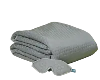 Folded light gray blanket with a matching sleep mask 